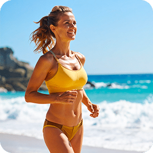 Woman jogging on the beach